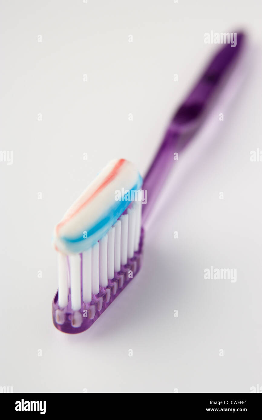 Toothbrush loaded with toothpaste Stock Photo