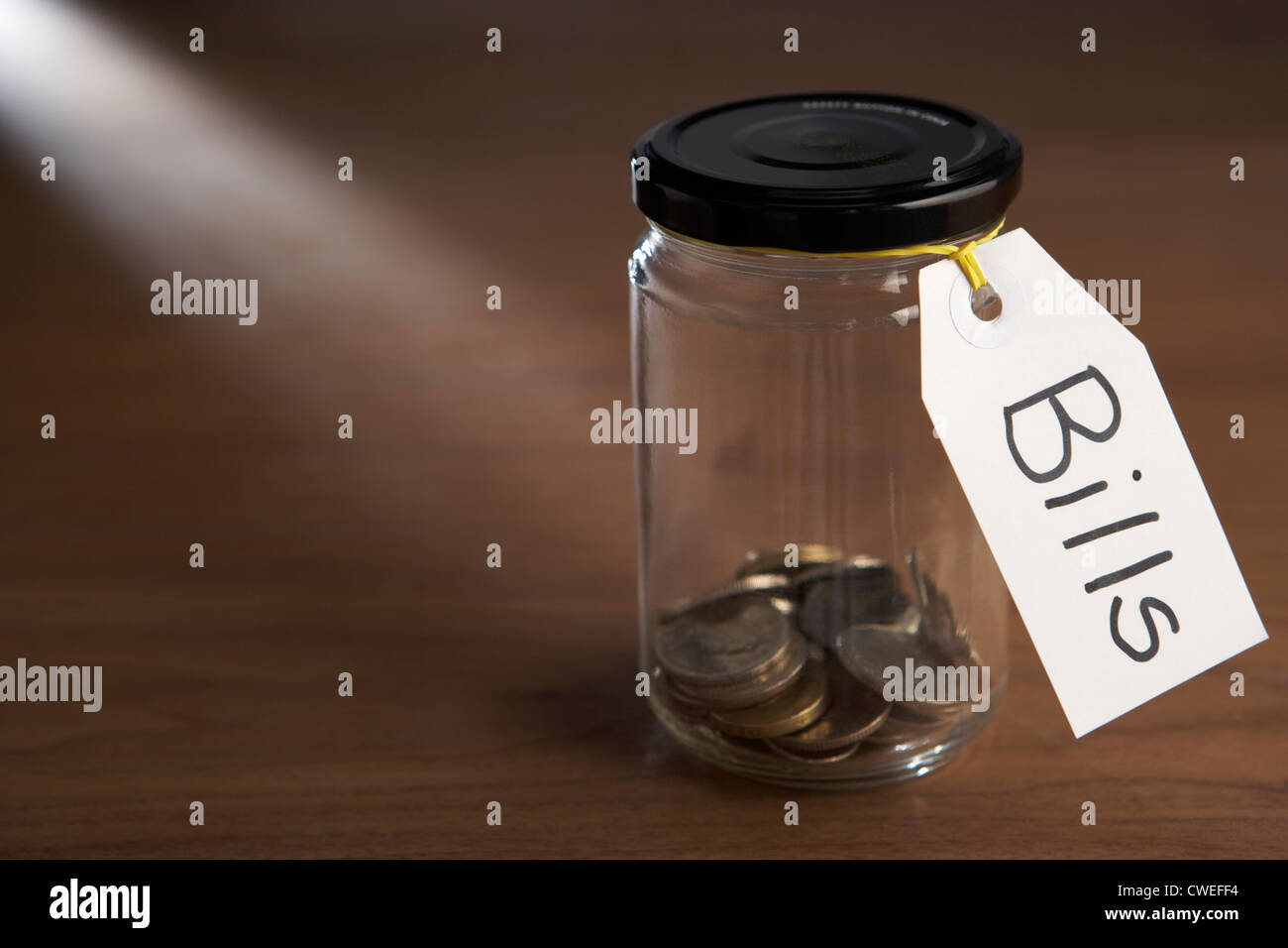 Coins in a jam jar Stock Photo