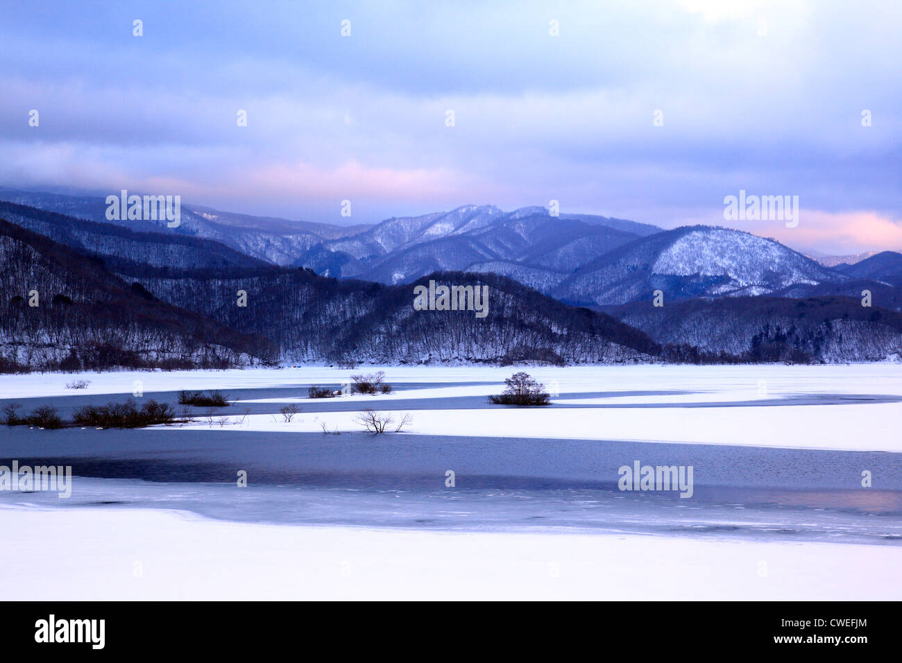Beautiful Scenery Of Frozen Lake And Mountain Ranges Stock Photo