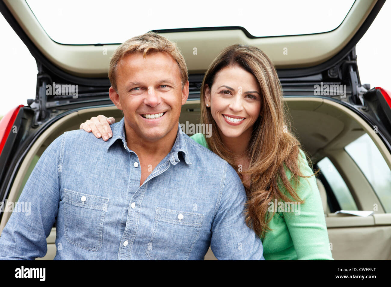 Couple outdoors with car Stock Photo