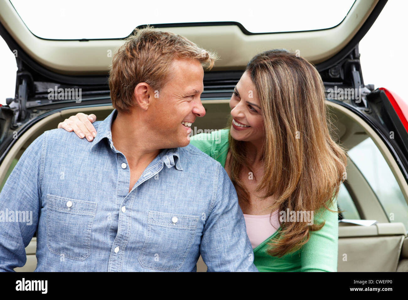 Couple outdoors with car Stock Photo