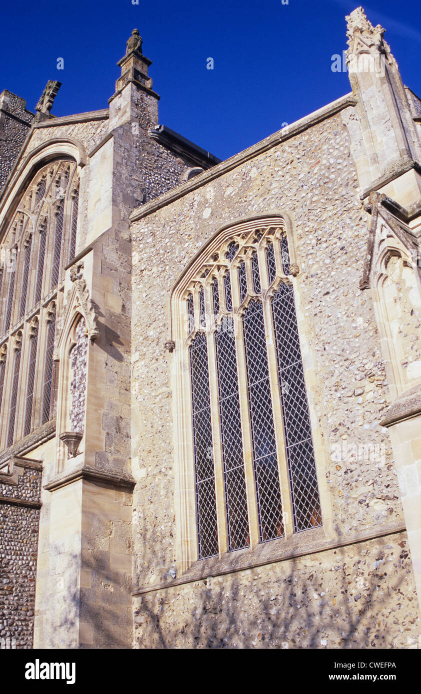 Detail of flint wall and windows and stone flying buttresses of 15th