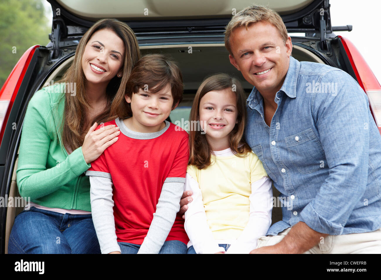 Family outdoors with car Stock Photo