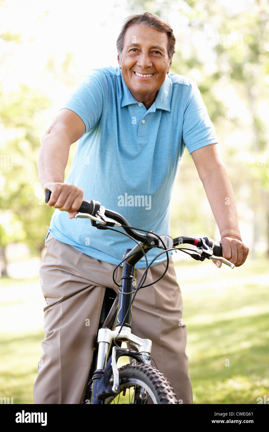 Older man riding exercise bike hires stock photography and images Alamy