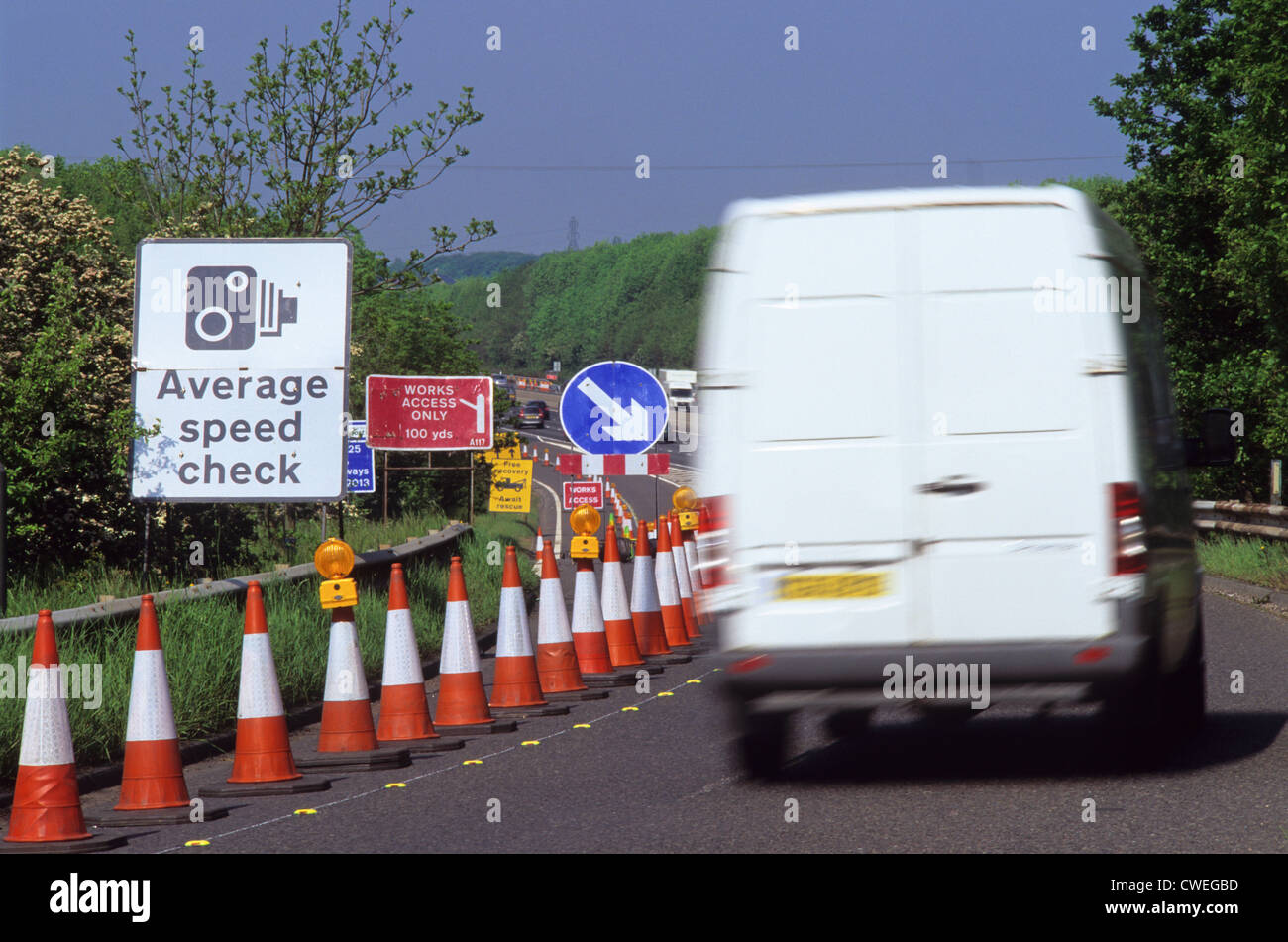 van passing warning sign of average speed cameras on the m62 motorway near leeds yorkshire uk Stock Photo