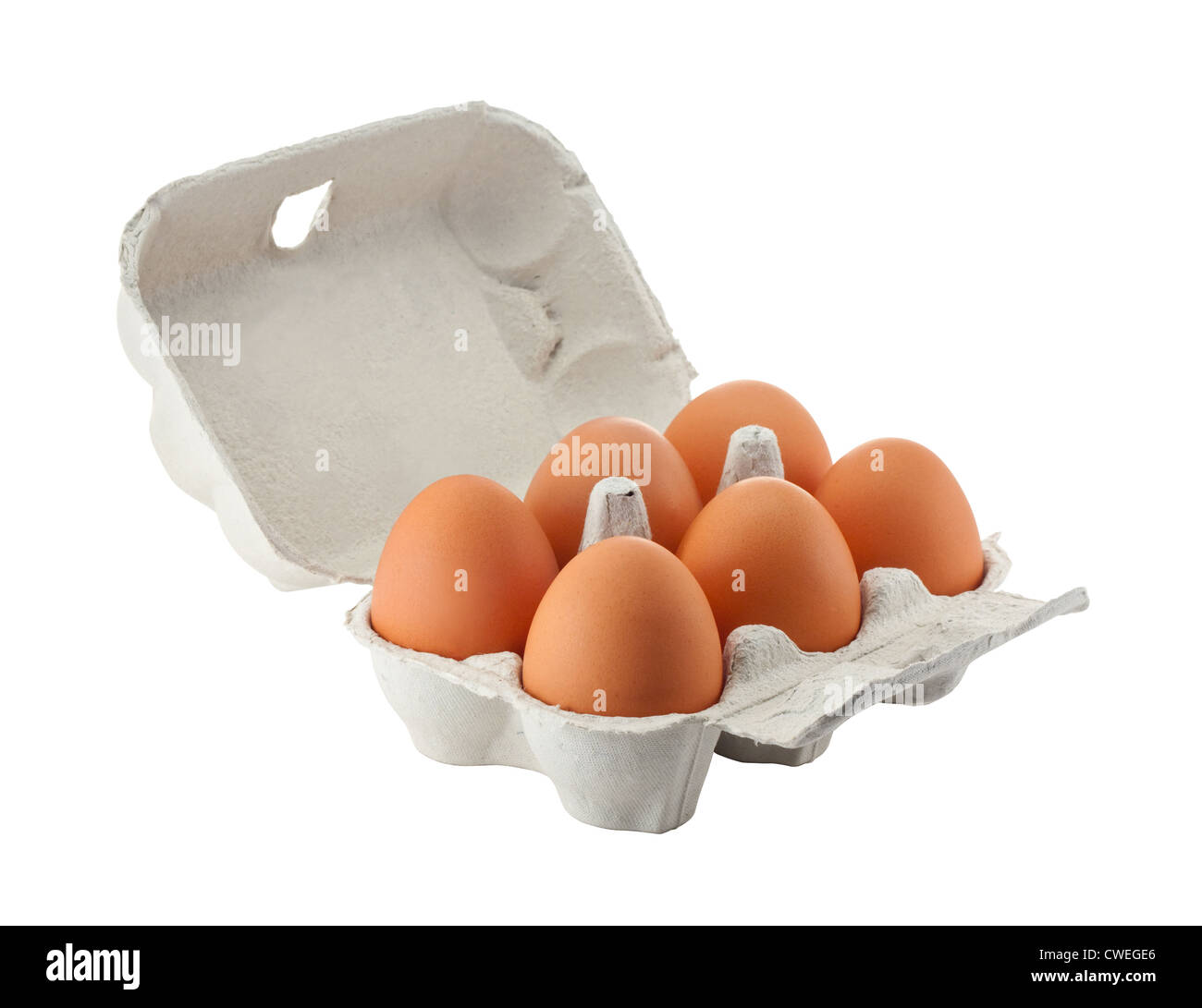 Cardboard egg box with six brown eggs isolated with clipping path Stock Photo