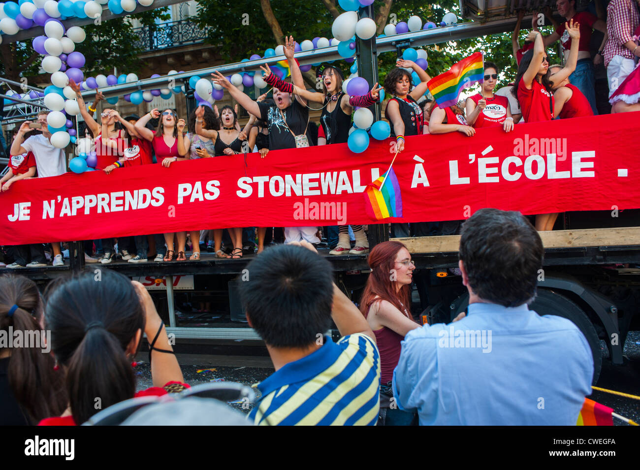 Paris, France, Students Celebrating at Gay Pride March, Float with Banner reading 'At School We never Learn about the Stonewall Riots' gay rights struggle, young lesbians and gay men Stock Photo