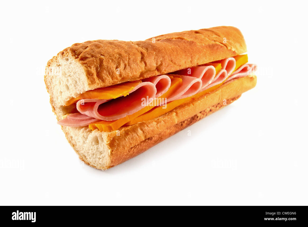 A homemade sandwich baguette with two of the most popular fillings ham and cheese, made with freshly baked french bread Stock Photo