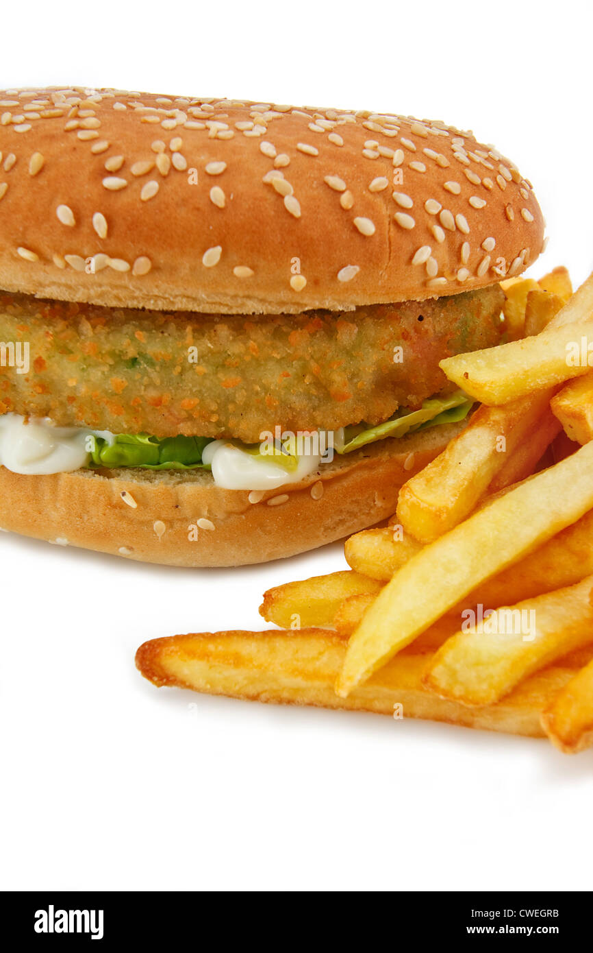Close up of a breadcrumbed vegetarian or veggie burger and fries, could also be used for chicken burger or fish burger Stock Photo