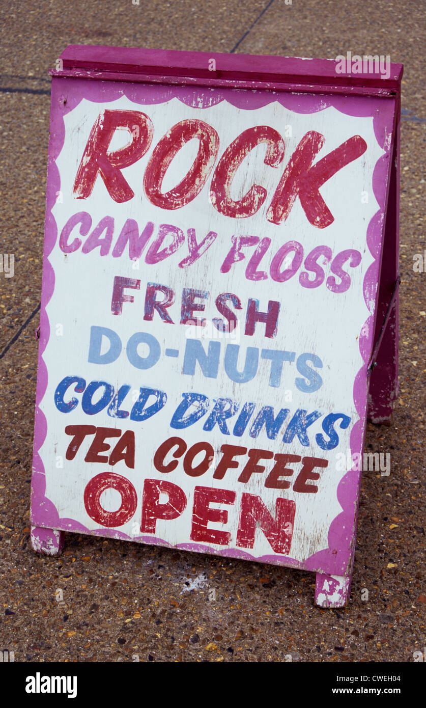 Sandwich-board standing on pavement stating in various colours and letterings Rock Candy floss Tea Coffee Open Stock Photo