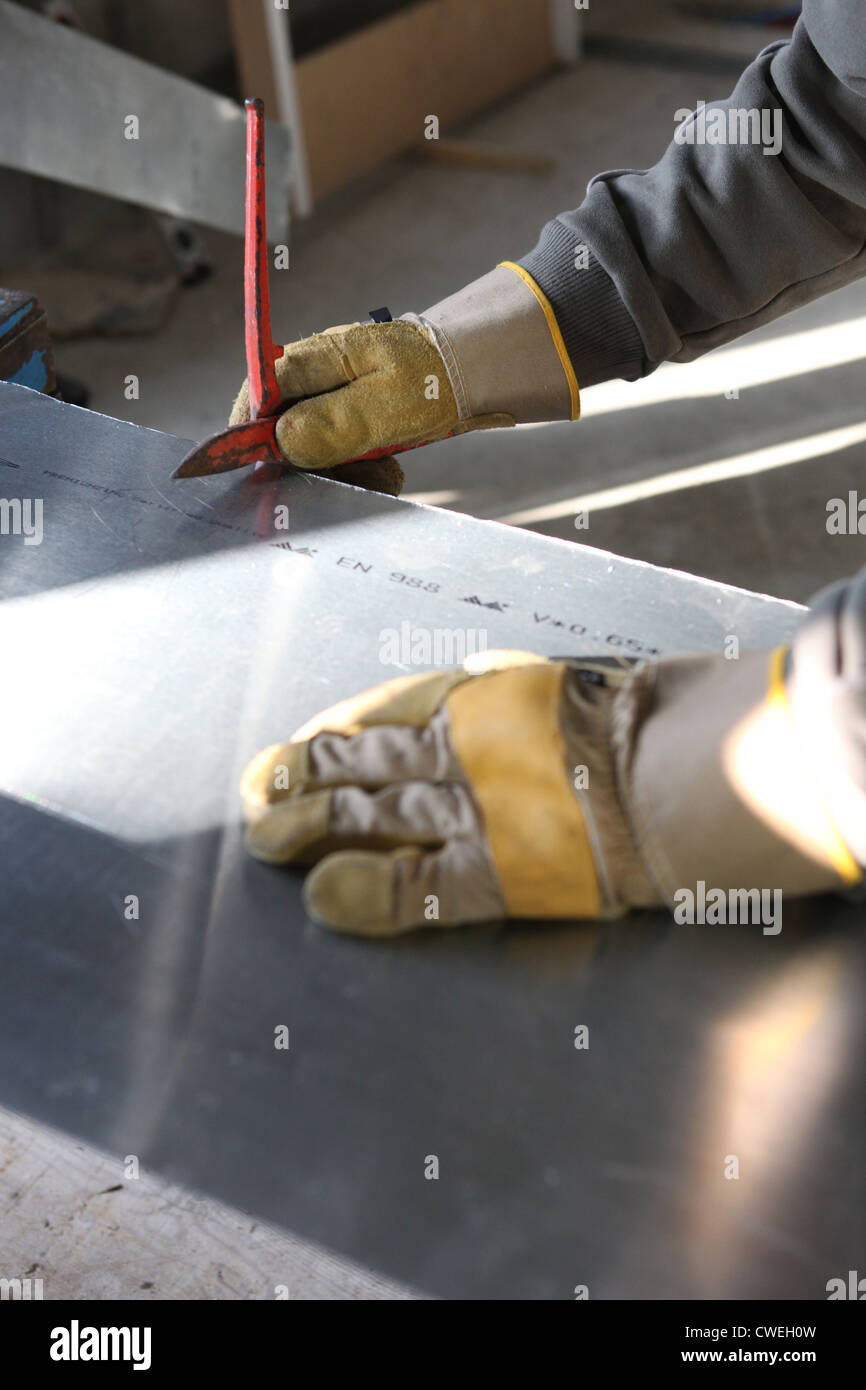 Cutting zinc Stock Photo