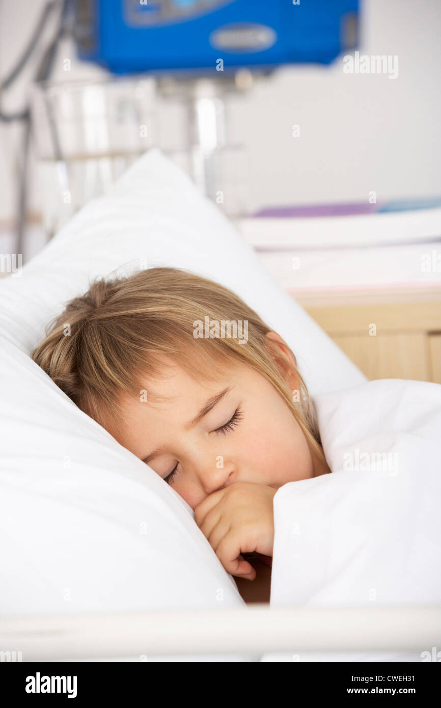 Young girl asleep in Accident and Emergency bed Stock Photo