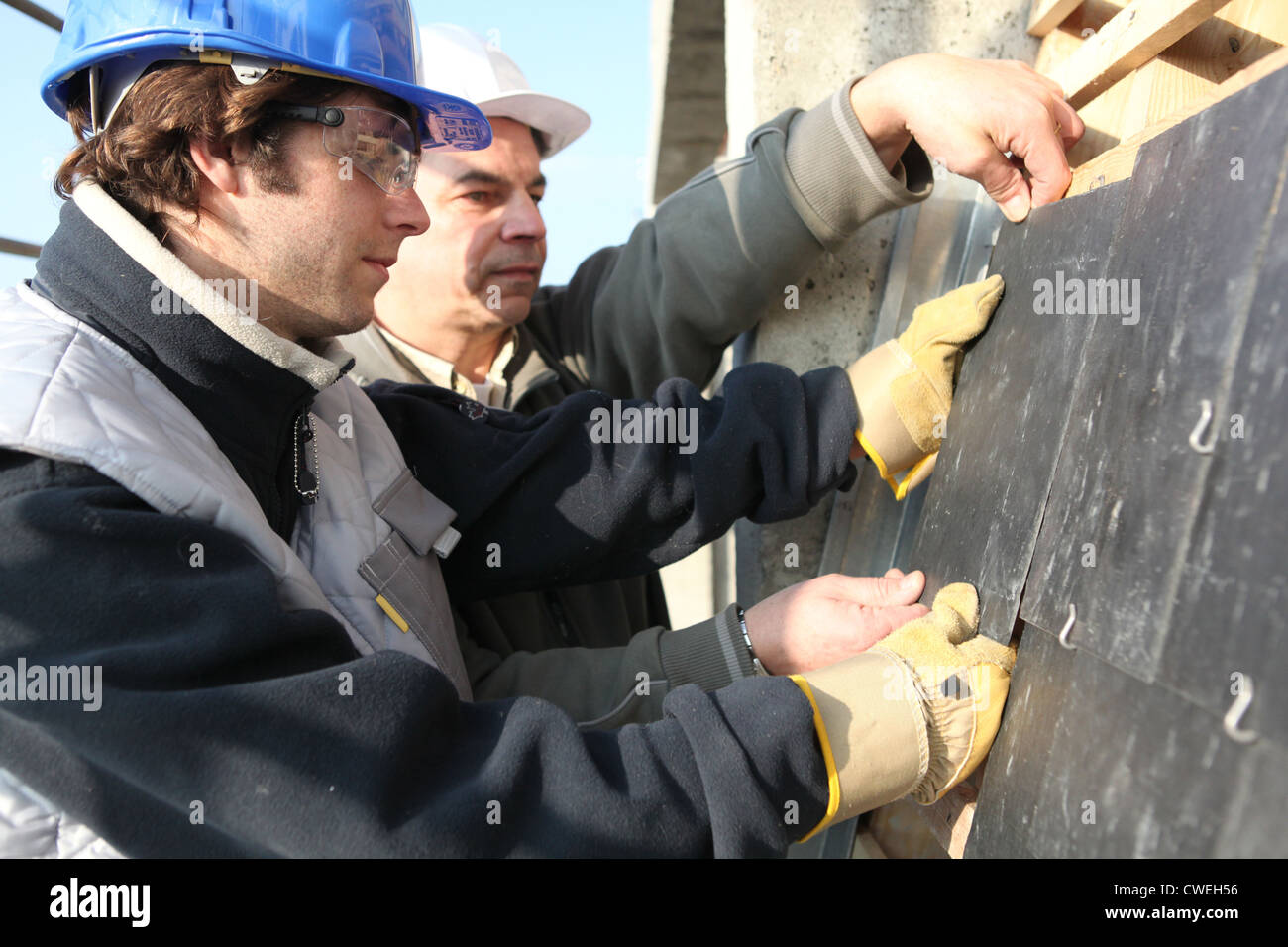 craftsman and apprentice working together Stock Photo