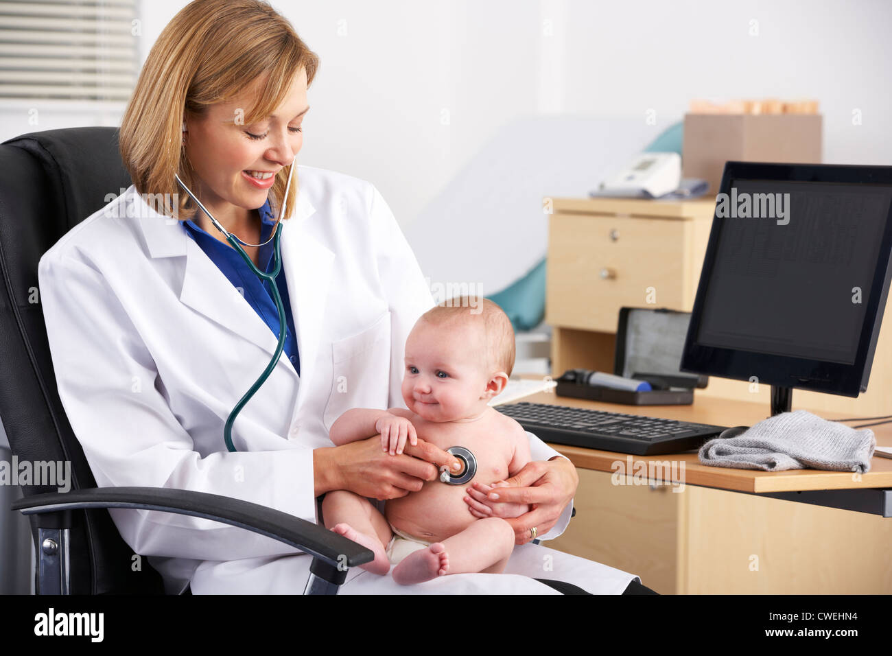 American doctor examining baby Stock Photo - Alamy