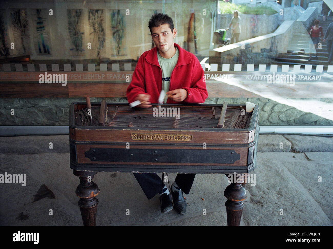 Young man playing gypsy music on a dulcimer, Plovdiv, Bulgaria Stock Photo