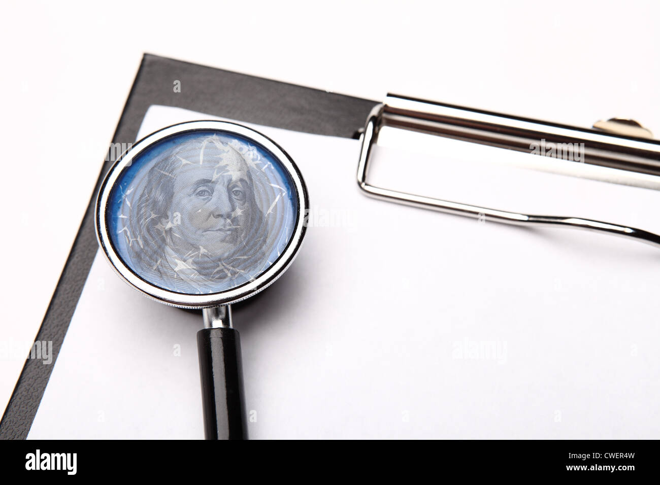 clipboard and portrait of Benjamin Franklin on the stethoscope diaphragm Stock Photo