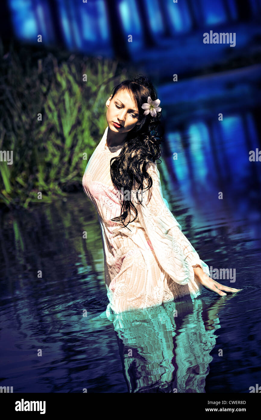 an outdoor portrait of a young woman in the water Stock Photo - Alamy
