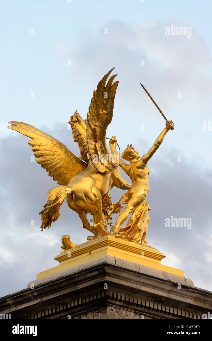 Golden statue at Pont Alexandre III is a deck arch bridge 