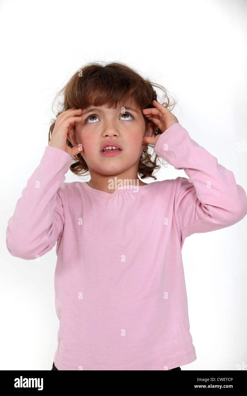 Young girl looking anxious Stock Photo - Alamy