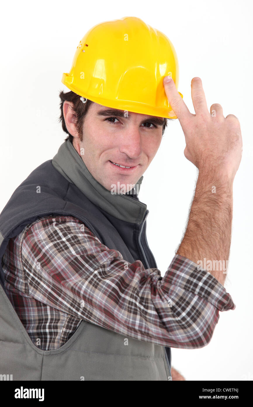 Builder tipping hat Stock Photo Alamy