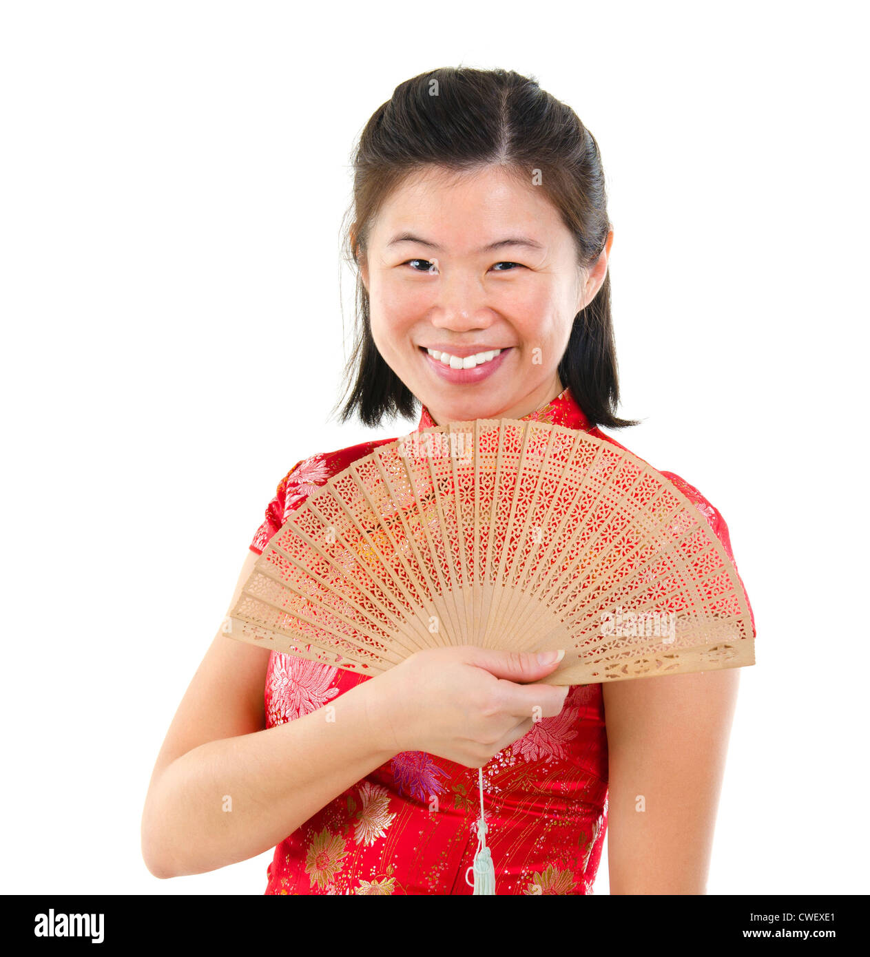 Oriental female with Chinese traditional dress Cheongsam and Chinese Fan Stock Photo