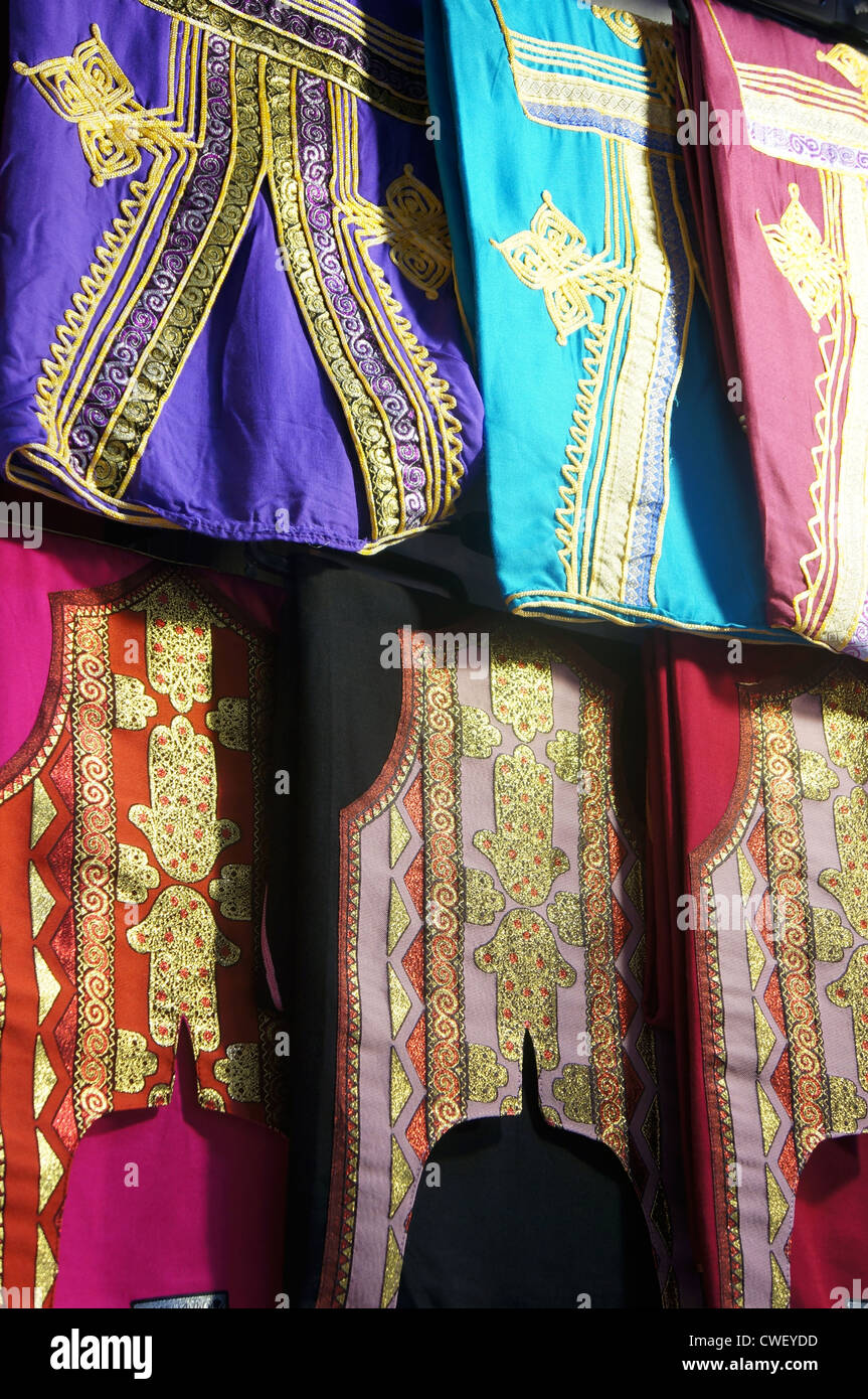 Tunisian colorful clothes hanging in a bazaar Stock Photo