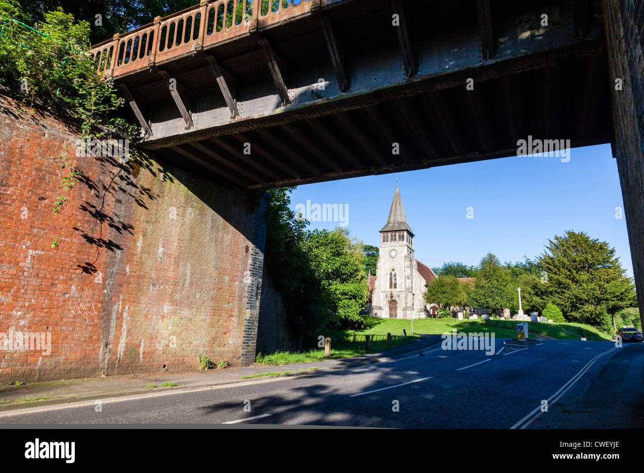 The Church of St Nicholas at Wickham, Hampshire, Seen from under a disused Railway bridge, UK Stock Photo