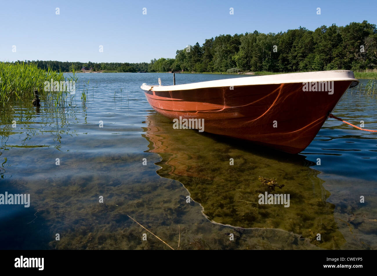 rowing boat sweden countryside summer summertime clear clean fresh water lake lakes swedish Stock Photo