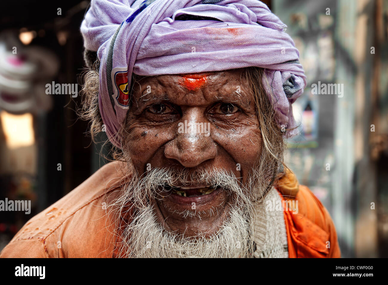 Indian Sadhu in colorful attire. Varanasi, Uttar Pradesh, India Stock Photo