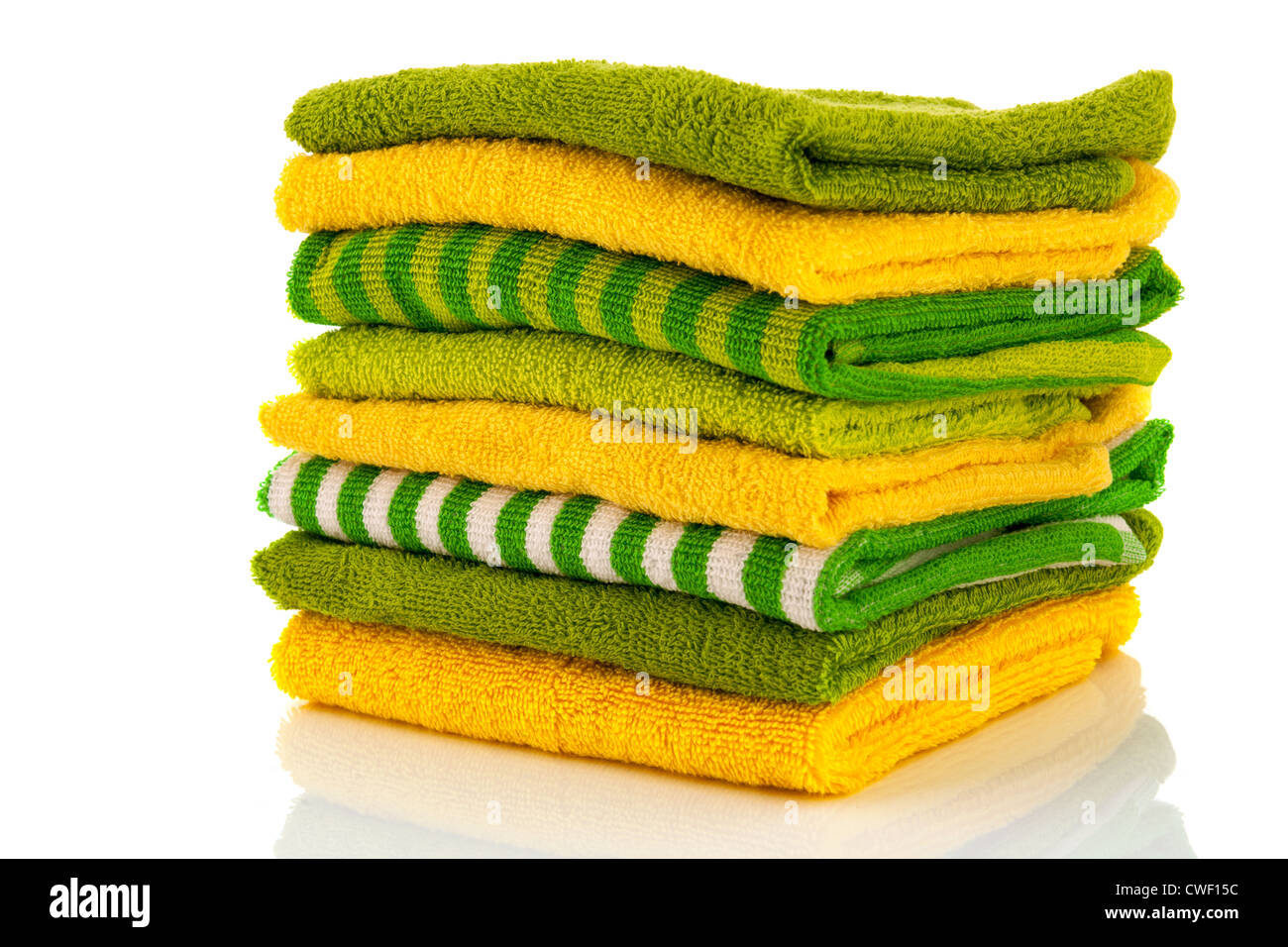 Stacked green and yellow towels Stock Photo Alamy