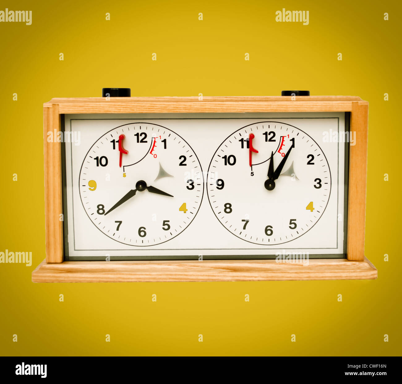 Retro chess clock on yellow background Stock Photo Alamy
