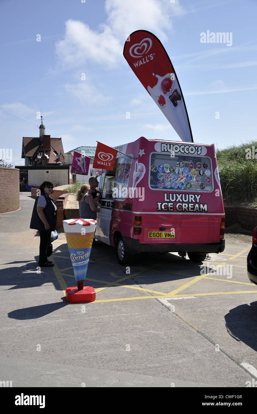 Pink and white ice cream with long oval sign advert on hot August at