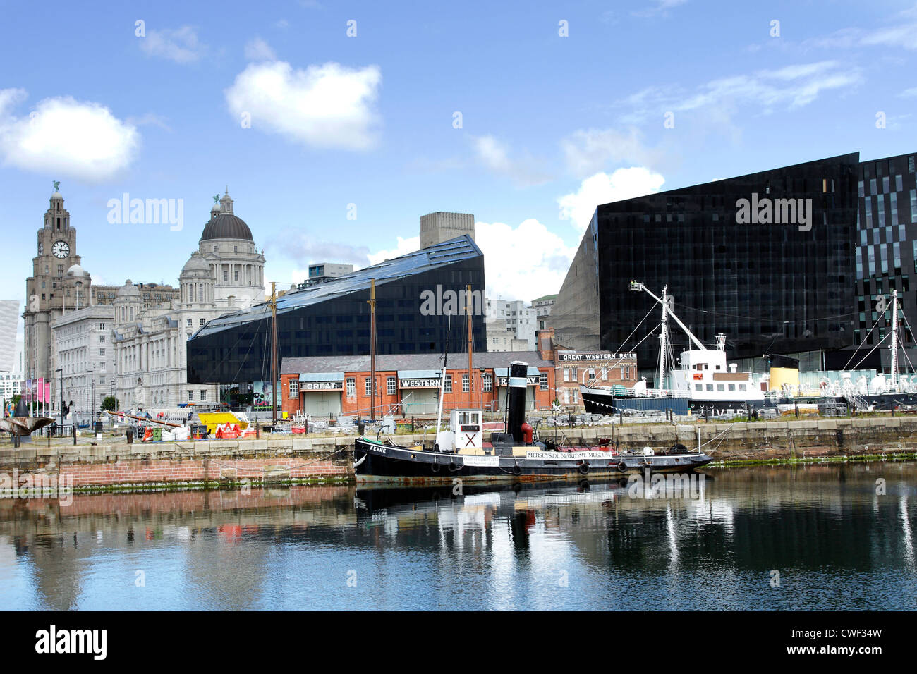 A view of the historic Liver Buildings in Liverpool, Merseyside, with modern office blocks in front. Stock Photo
