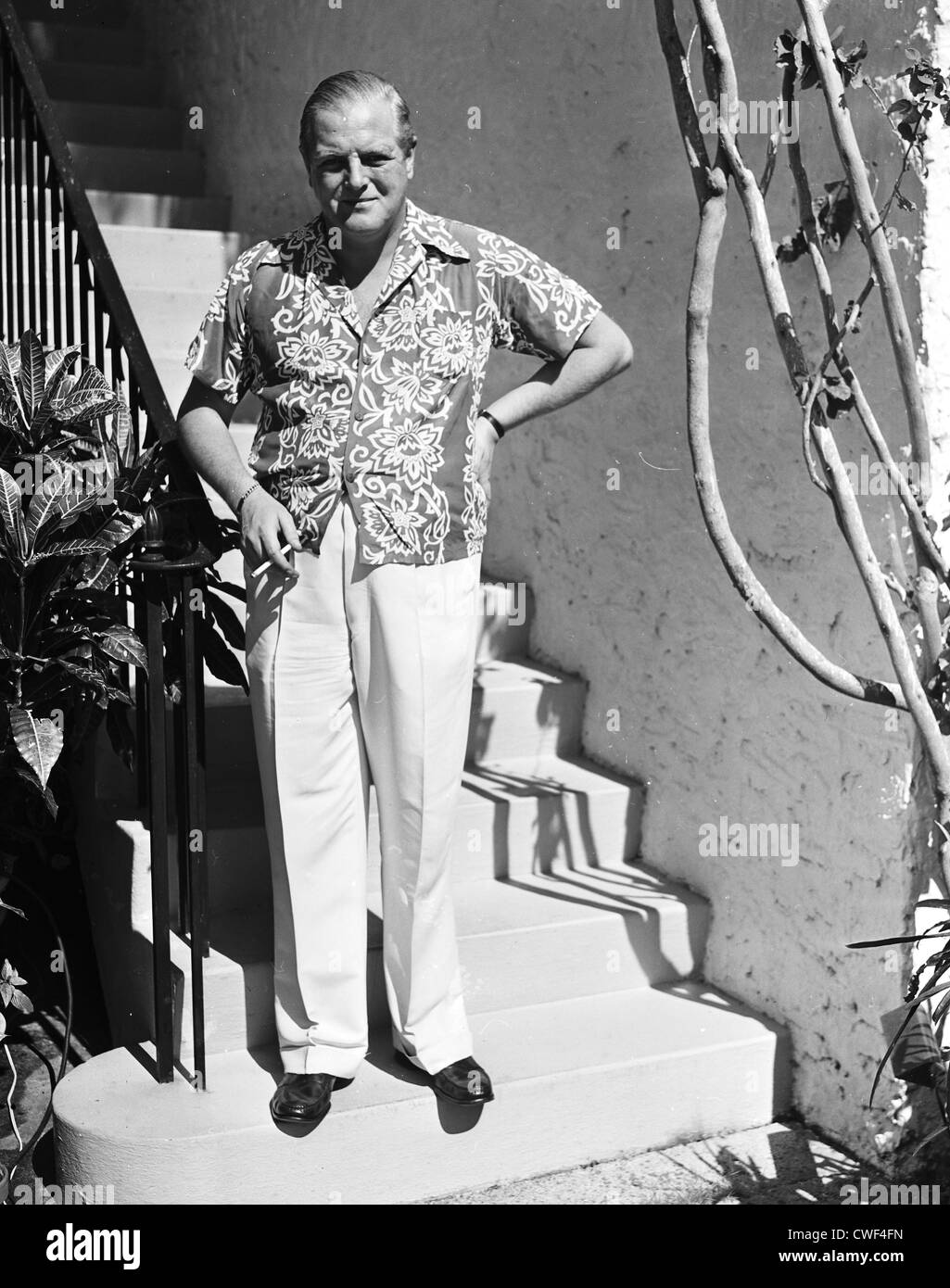 Randolph Churchill smoking a cigarette in Palm Beach, Florida, ca 1950 Stock Photo