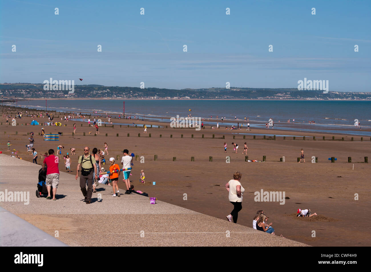 Holidaymakers On Dymchurch Beach Kent UK On A Summers Day Seaside Seasides Stock Photo