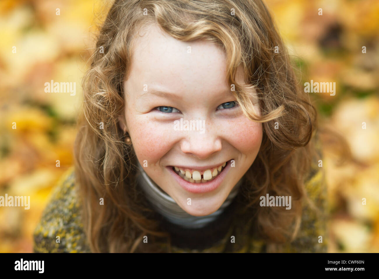 Outdoor high angle portrait of smiling blond girl in autumn park Stock ...