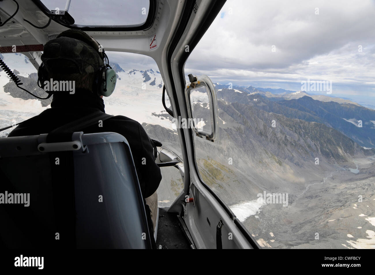 A helicopter pilot in tourist sightseeing helicopter flight over Franz