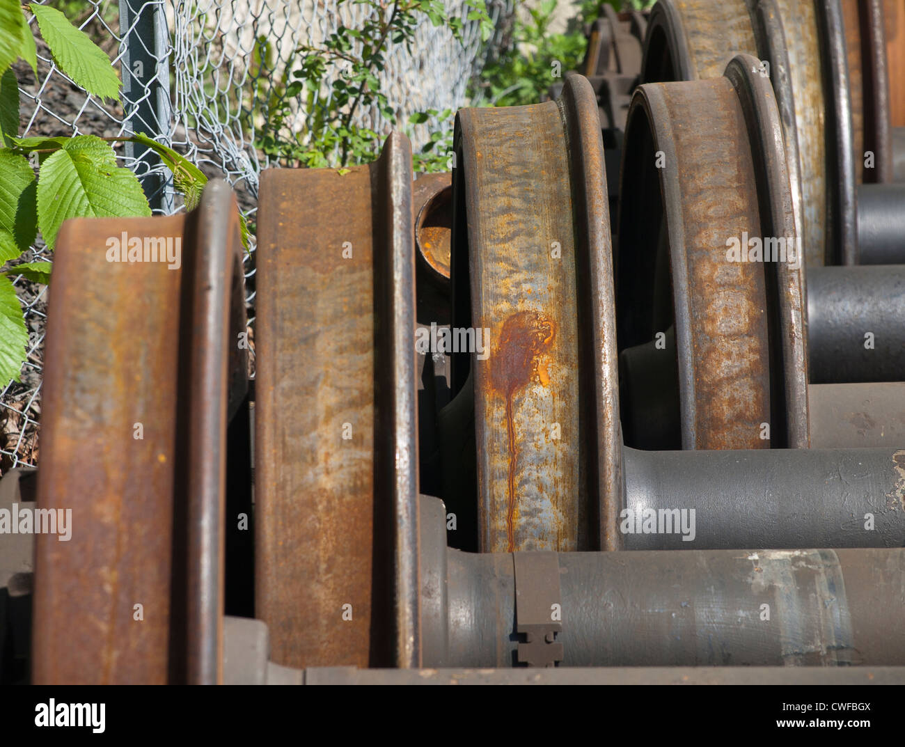 Closeup of wheels rusting while waiting to be used for train maintenance Stock Photo