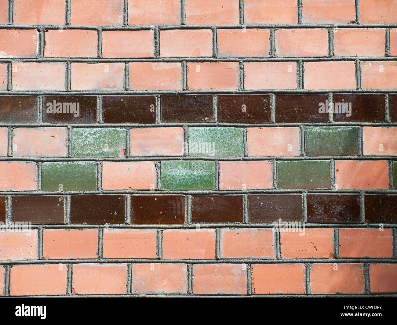 Detail of bricks on an old school building with glazed bricks as decoration element Stock Photo