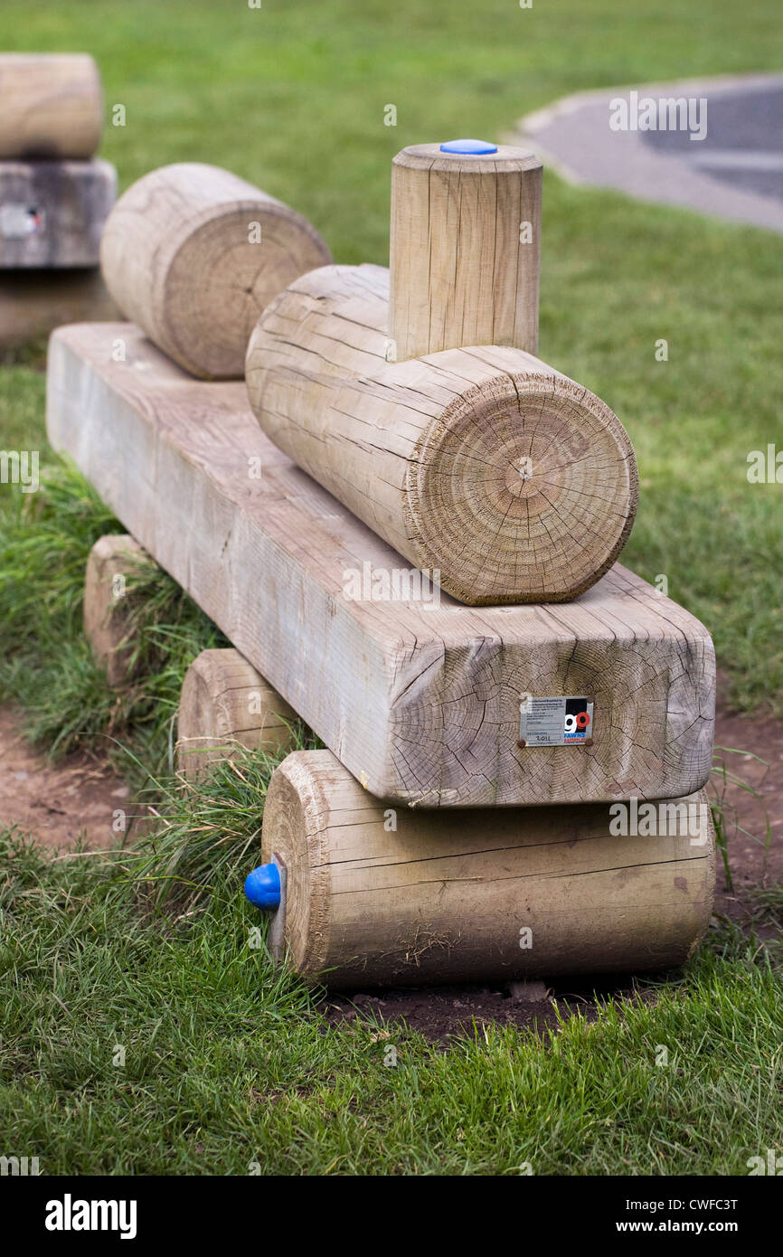 Children's play equipment in an English park. A wooden toy train. Stock Photo