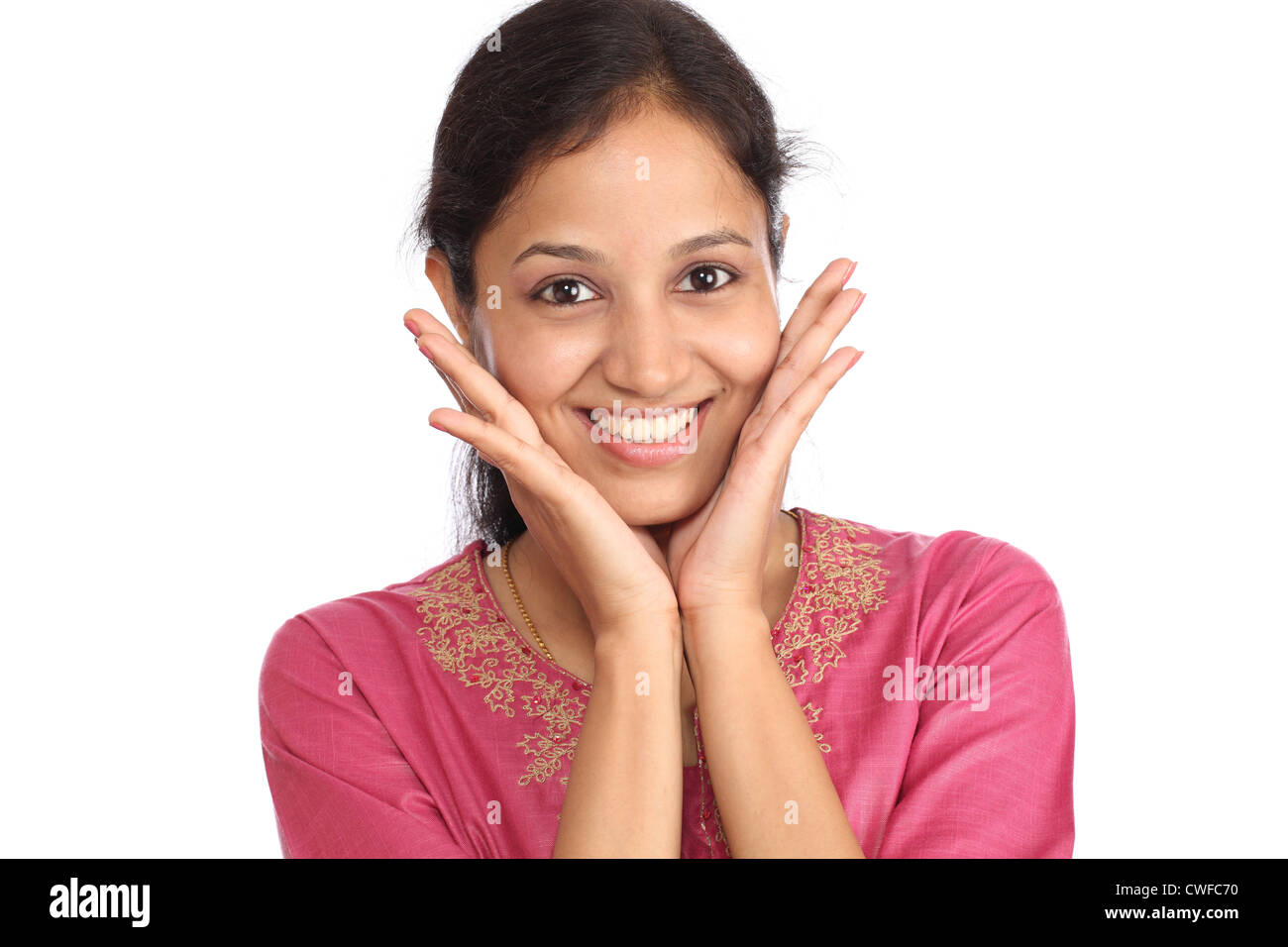 Surprised young woman against white background Stock Photo - Alamy