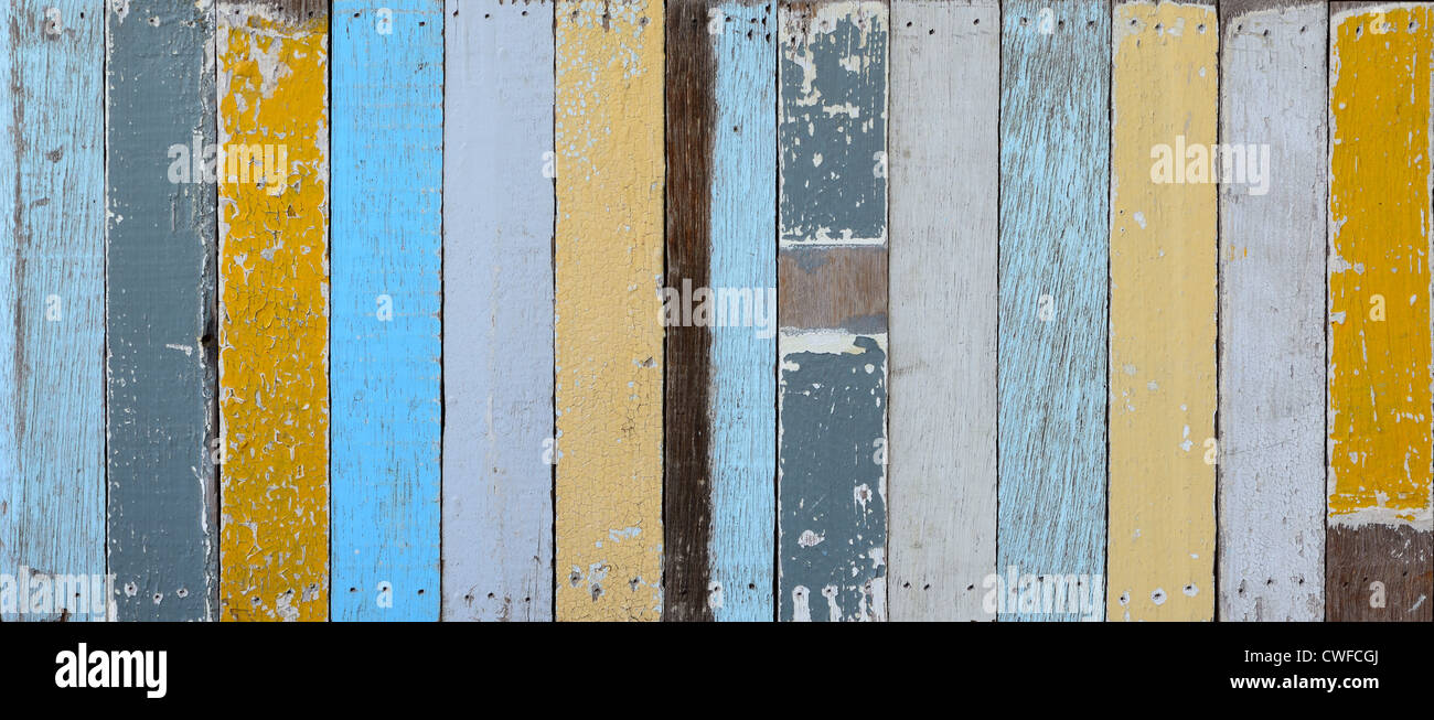 The old painted wooden wall with variety color. Stock Photo