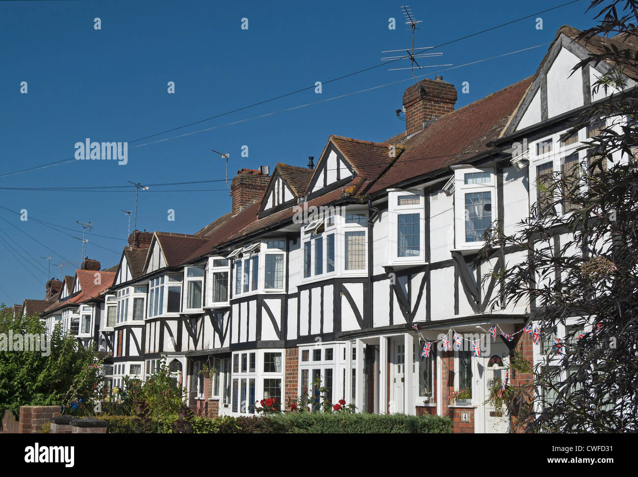 mock tudor houses forming a terrace, north kingston, surrey, england Stock Photo