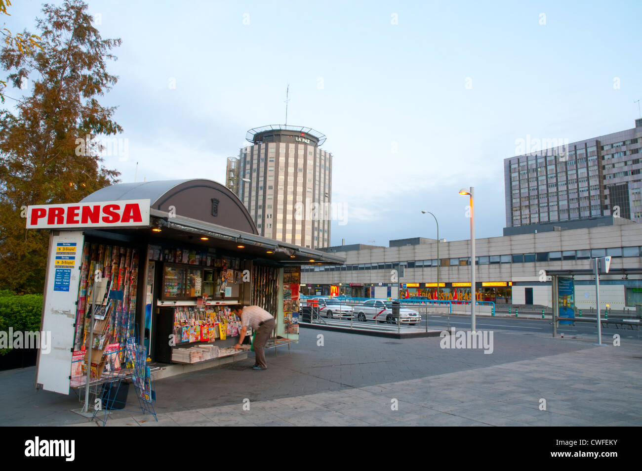 Newspaper stand and La Paz hospital at dawn. Madrid, Spain. Stock Photo