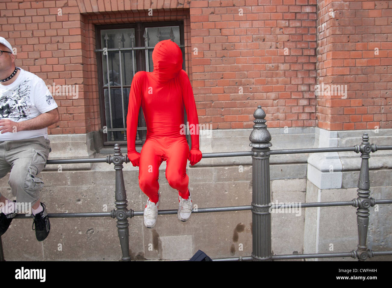 Christopher Street Day in Berlin. Man in a red bodysuit. Stock Photo