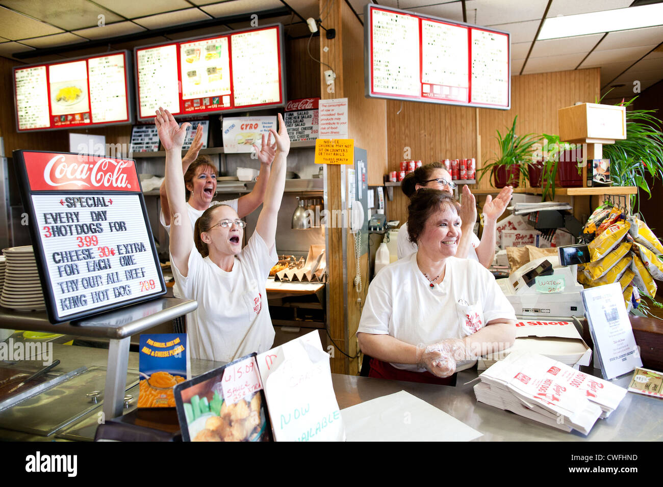 Restaurant staff celebrate as President Barack Obama stops for lunch at Rudy's Hot Dog in Toledo, Ohio, June 3, 2011. (Official Stock Photo