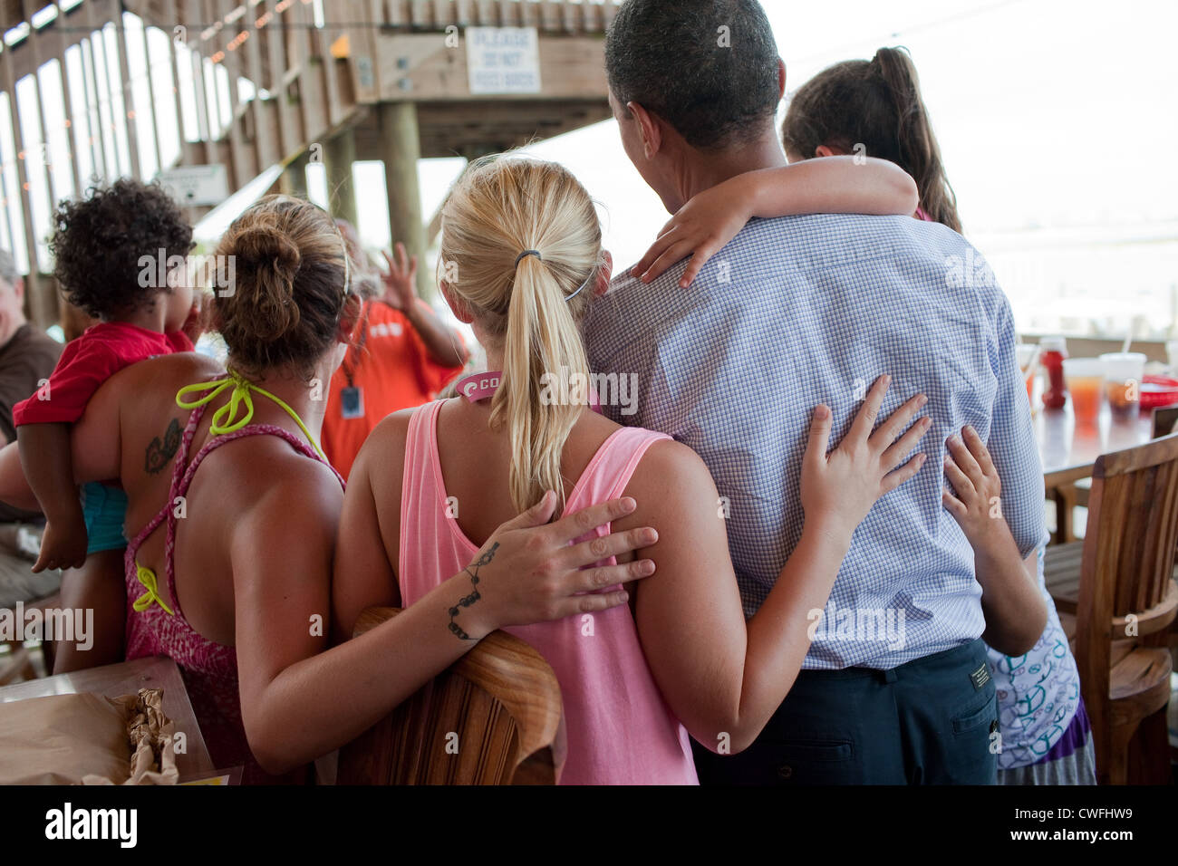 President Barack Obama poses for a picture with patrons at Tacky Jack's, a seafood restaurant in Orange Beach, Ala., June 14, 20 Stock Photo