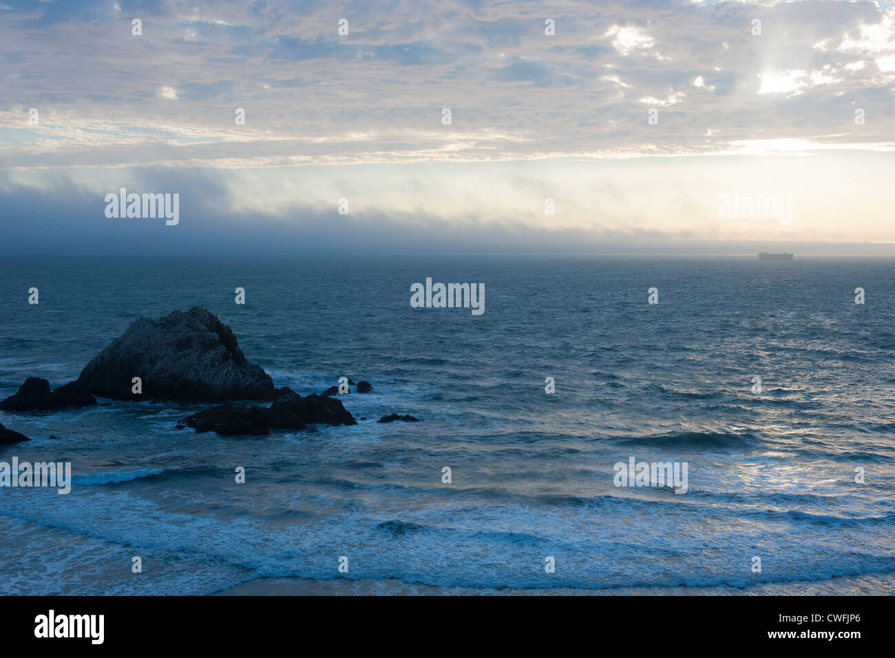 USA California CA San Francisco Pacific Ocean Seal Rocks - freighter tanker heading out to sea at sunset Stock Photo