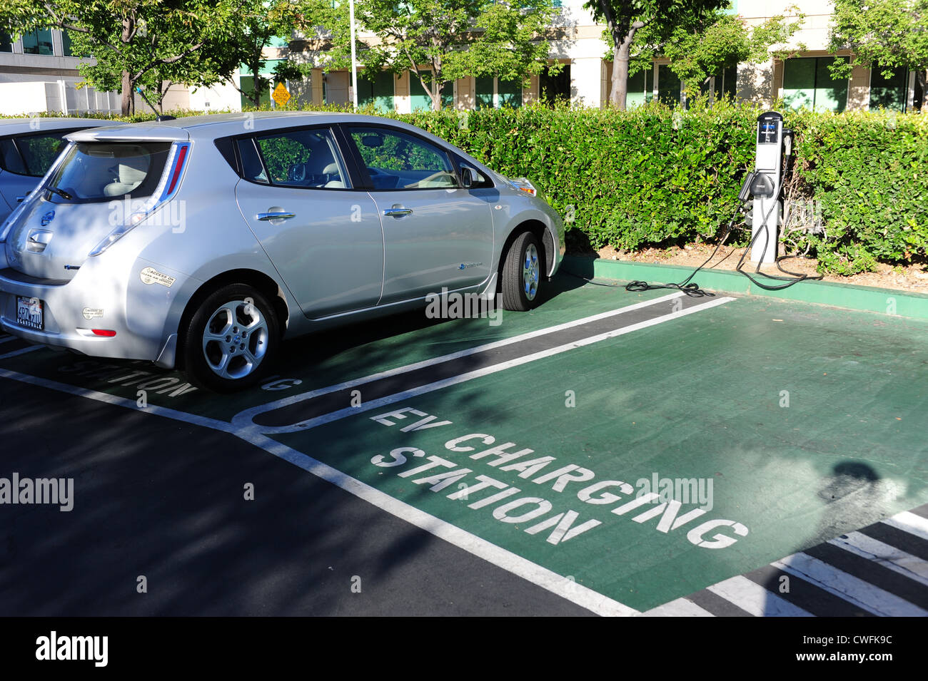 Electric Vehicle charging station at an office park in Cupertino, California Nissan Leaf Auto EV refueling Stock Photo