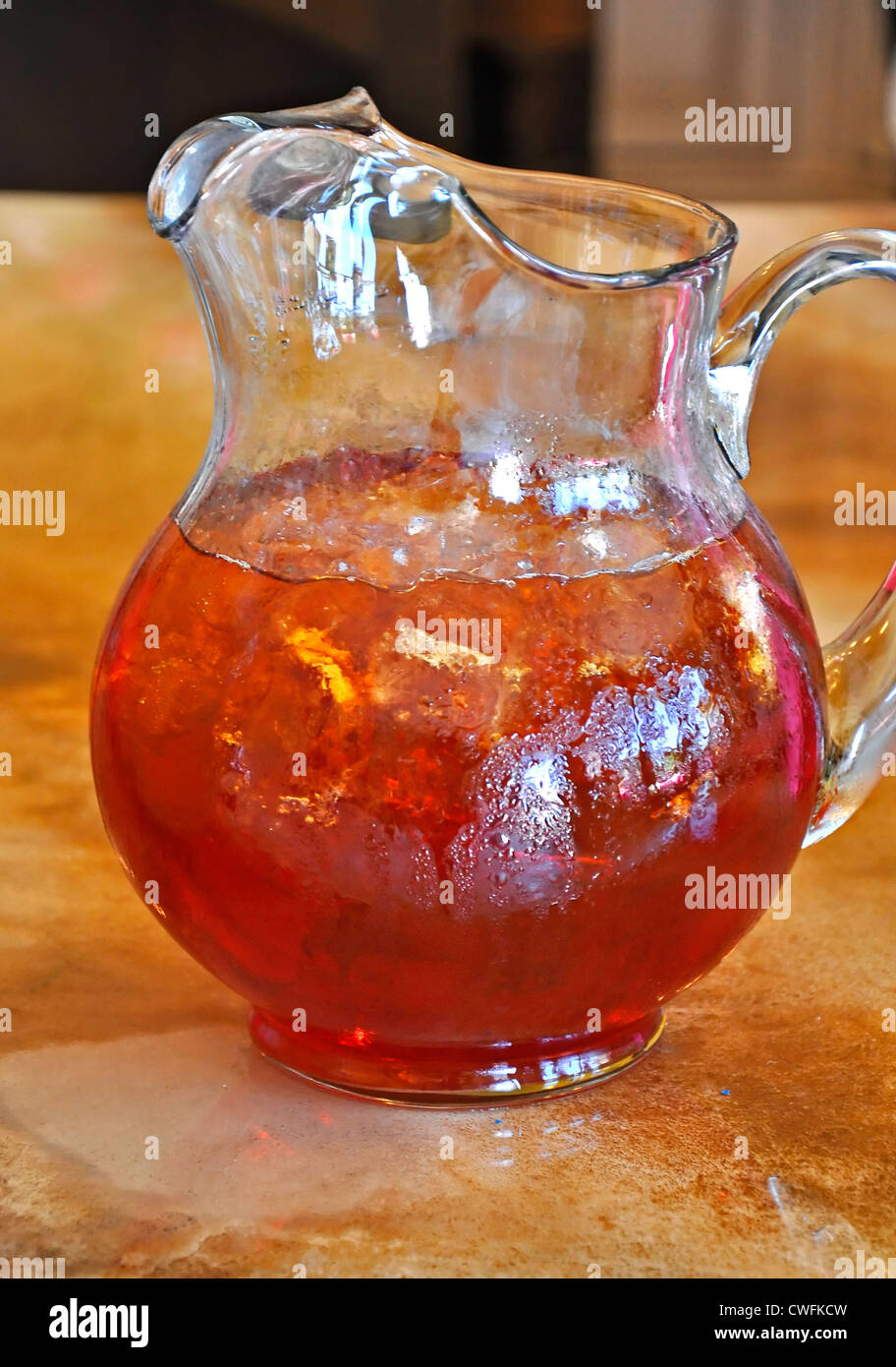 https://c8.alamy.com/comp/CWFKCW/this-is-a-vertical-stock-image-of-a-tall-glass-pitcher-of-iced-tea-CWFKCW.jpg